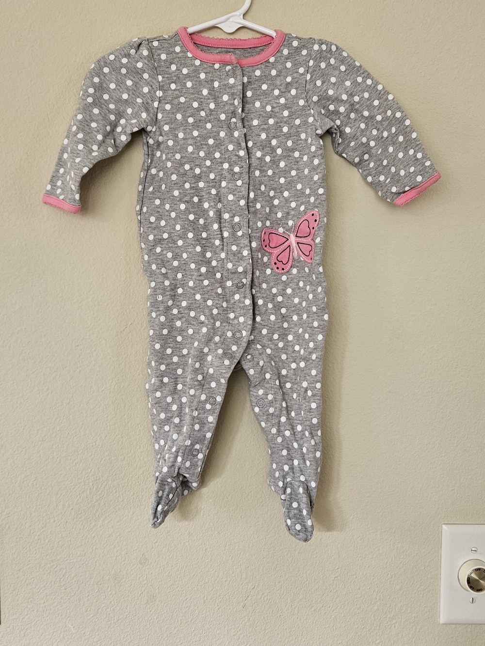 Grey Polka Dot Footed One-Piece with Pink Trim and Butterfly Accent